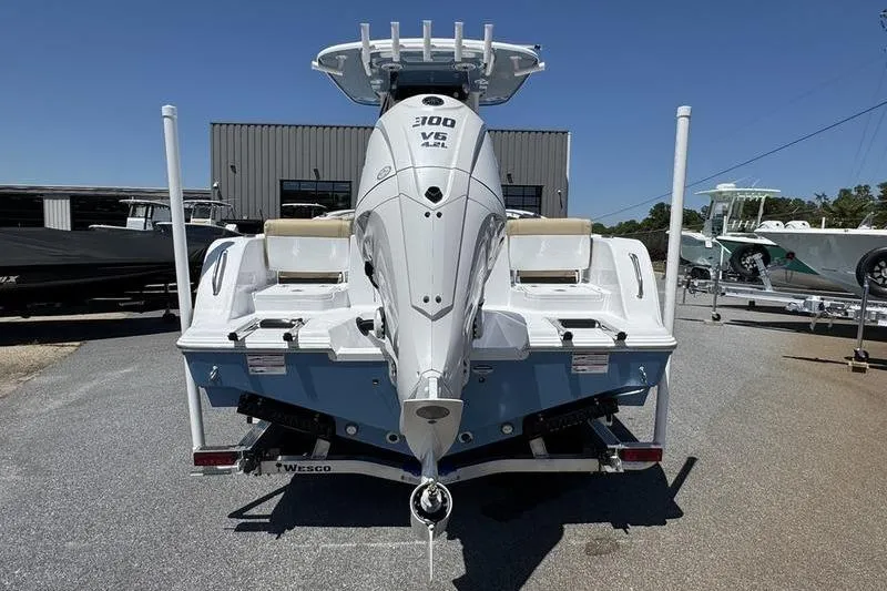 Slide: The Image of 2026 Sportsman Heritage 231 Center Console boat with powerful 300 V6 engine, rear view. - 11