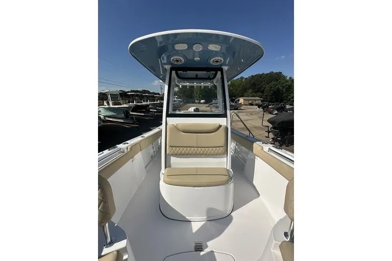 Slide: The Image of 2026 Sportsman Heritage 231 Center Console boat interior with seating and console view. - 23