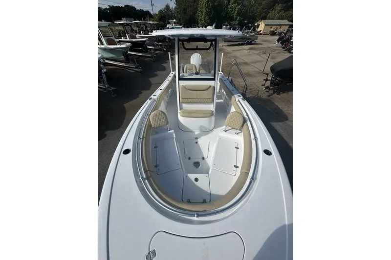Slide: The Image of 2026 Sportsman Heritage 231 Center Console boat with spacious seating and modern design. - 26