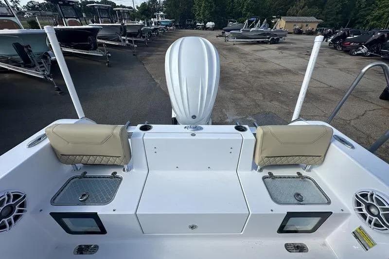 Slide: The Image of 2026 Sportsman Heritage 231 Center Console boat interior with seating and storage compartments. - 7
