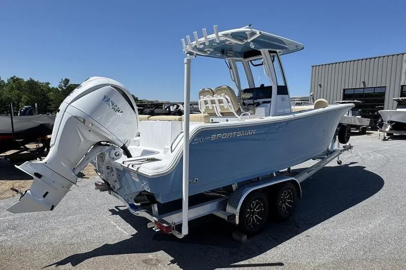 Slide: The Image of 2026 Sportsman Heritage 231 Center Console boat on trailer, featuring Yamaha outboard motor. - 9