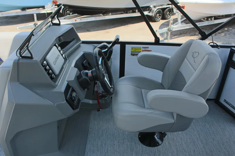 Slide: The Image of Captain's chair and helm of 2026 Qwest Lanai 816 boat with Garmin navigation system. - 12