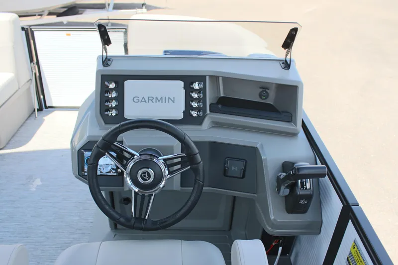 Slide: The Image of Steering console of 2026 Qwest Lanai 816 boat with Garmin navigation system. - 13