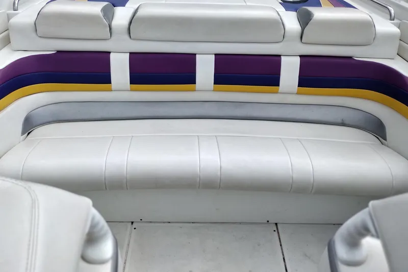 Slide: The Image of 2006 Formula 353 FASTech boat interior with white, purple, and yellow seating. - 16
