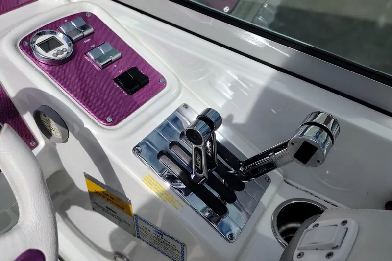 Slide: The Image of Control panel of a 2006 Formula 353 FASTech boat with chrome throttle levers. - 36