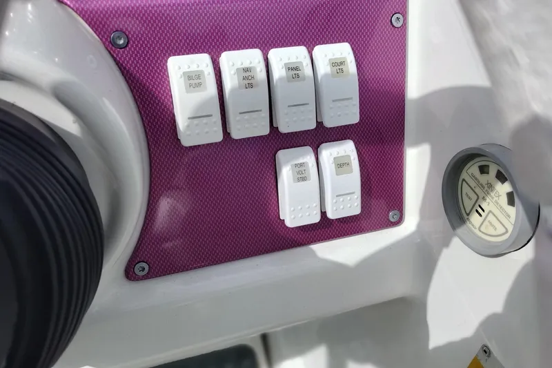 Slide: The Image of Control panel of a 2006 Formula 353 FASTech boat with labeled switches. - 38