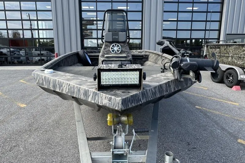 Slide: The Image of 2023 Havoc 1756 MRST boat with camouflage design, equipped with LED light bar and trolling motor. - 12