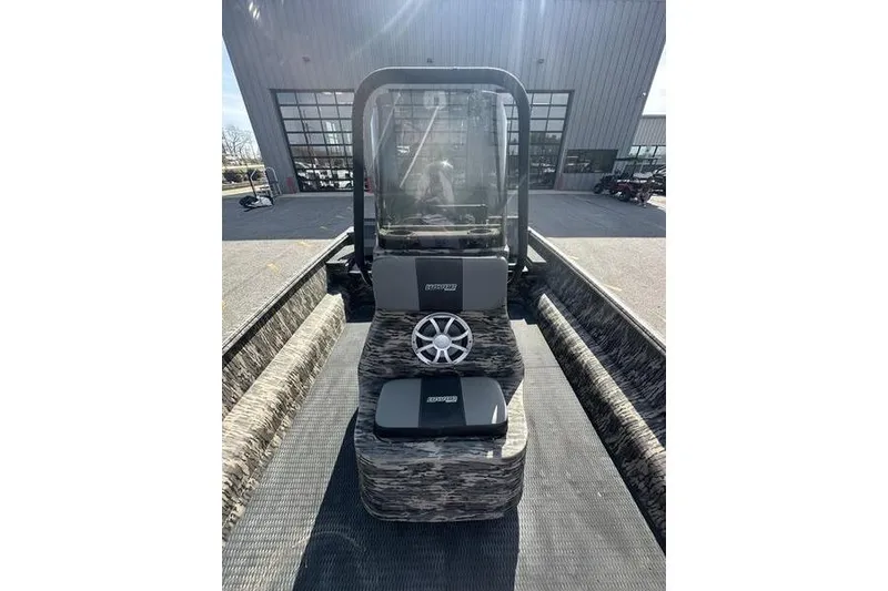 Slide: The Image of 2023 Havoc 1756 MRST boat interior with camo design and steering wheel. - 3