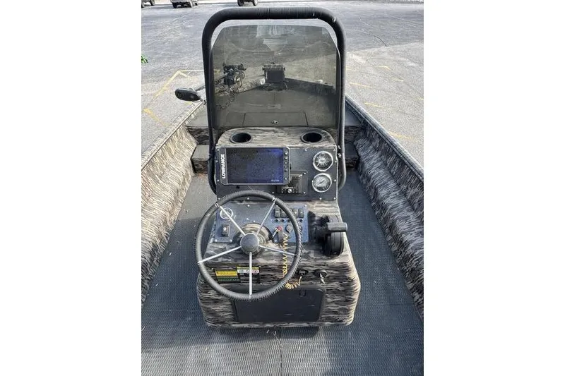 Slide: The Image of 2023 Havoc 1756 MRST boat console with steering wheel, gauges, and navigation system. - 7