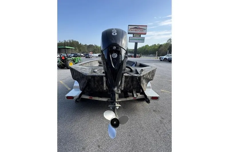 Slide: The Image of 2023 Havoc 1756 MRST boat on trailer, rear view with outboard motor. - 8