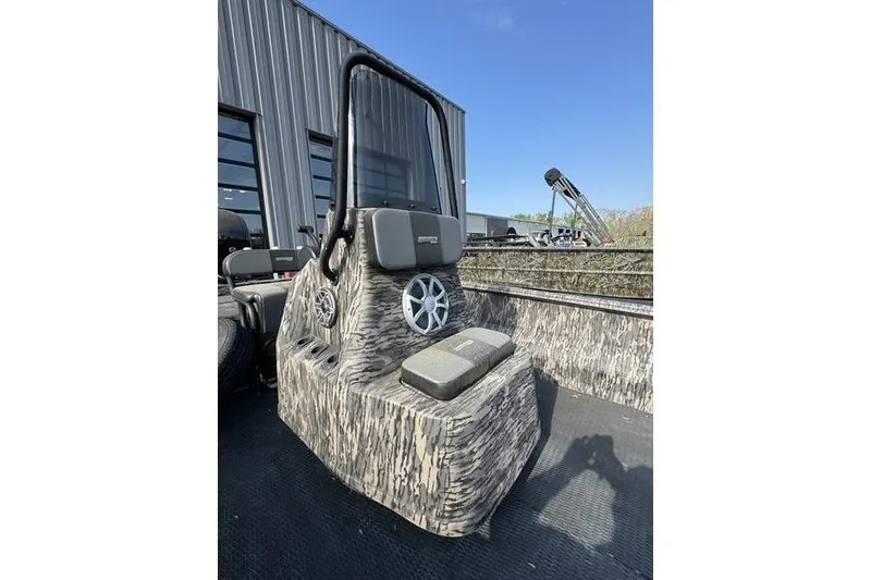 Slide: The Image of 2023 Havoc 1756 MRST boat with camouflage design and modern console, outdoors. - 9
