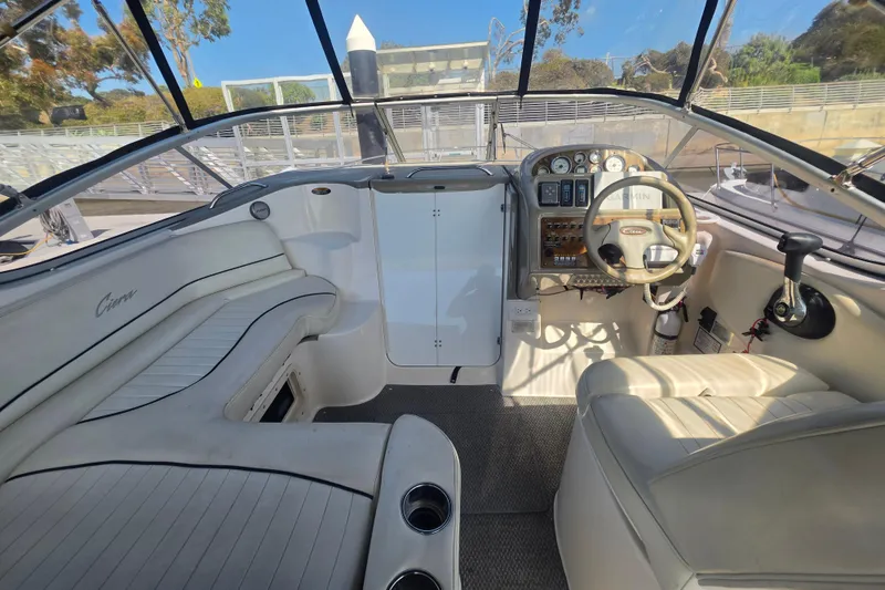 Slide: The Image of Interior of a 2000 Bayliner 2855 Ciera boat, featuring helm and seating area. - 13