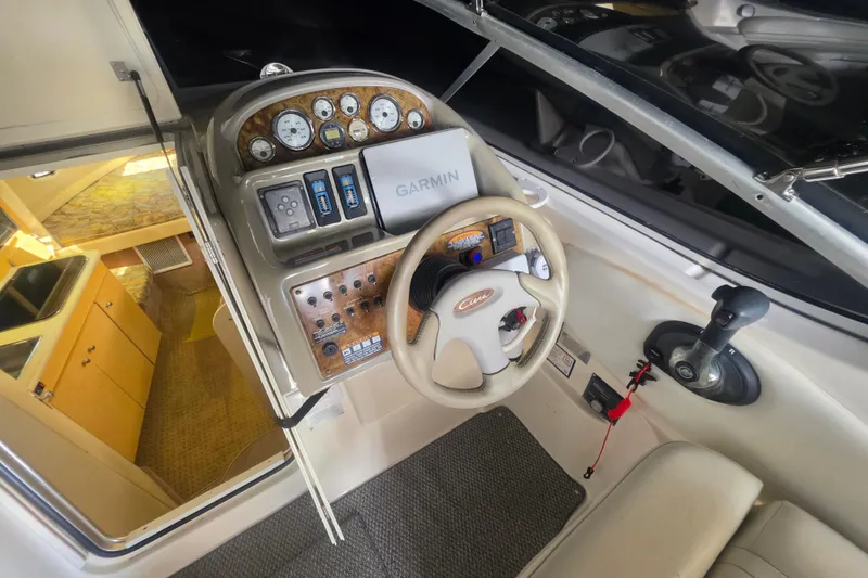 Slide: The Image of Cockpit of 2000 Bayliner 2855 Ciera with steering wheel and navigation controls. - 17