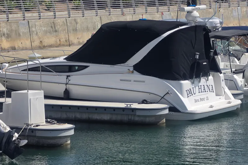 Slide: The Image of 2000 Bayliner 2855 Ciera boat docked at marina with black cover. - 31