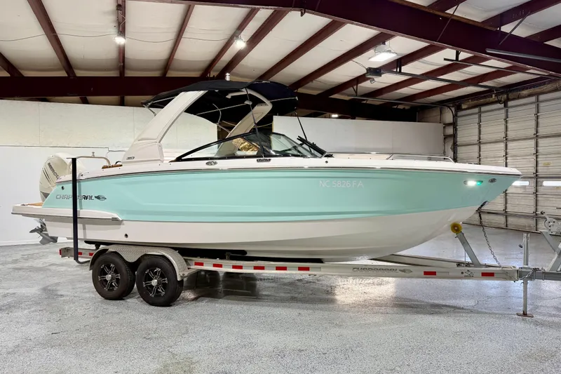Slide: The Image of 2023 Chaparral 270 OSX boat on trailer in indoor storage facility. - 10