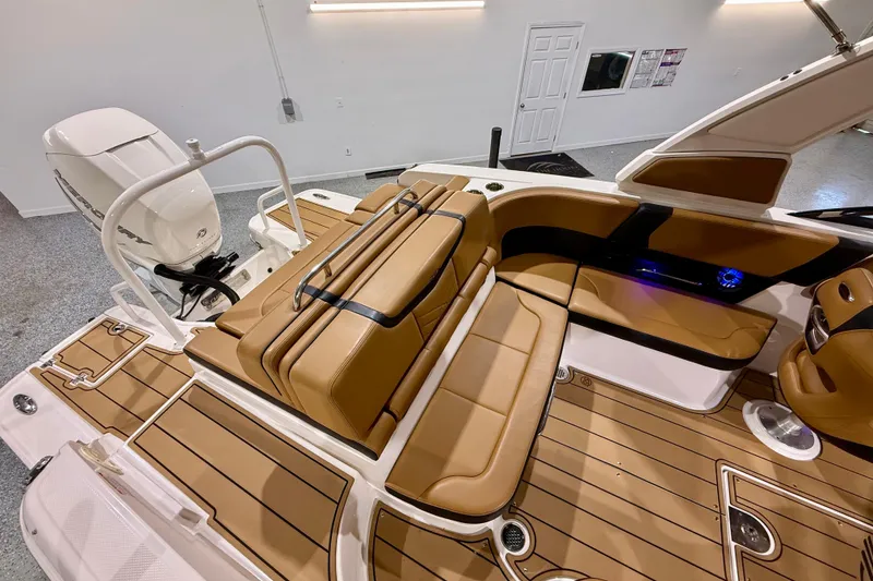 Slide: The Image of 2023 Chaparral 270 OSX boat interior with tan seating and modern design. - 20