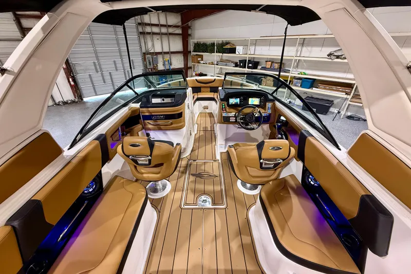 Slide: The Image of 2023 Chaparral 270 OSX boat interior with luxurious seating and modern dashboard. - 23