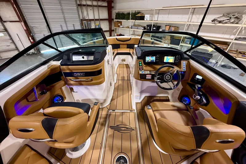 Slide: The Image of Interior of 2023 Chaparral 270 OSX boat with luxurious seating and modern dashboard. - 24