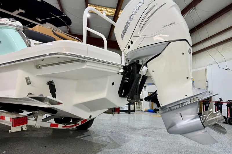 Slide: The Image of 2023 Chaparral 270 OSX boat with Mercury outboard engine in a showroom. - 3