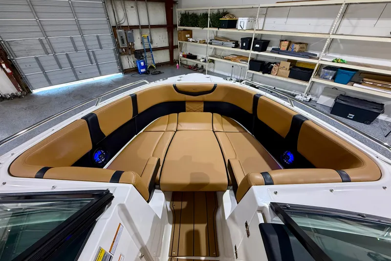 Slide: The Image of Luxurious interior of 2023 Chaparral 270 OSX boat with tan and black seating. - 33