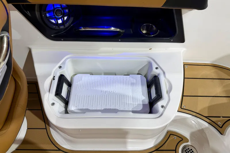 Slide: The Image of 2023 Chaparral 270 OSX boat interior with built-in cooler and speaker system. - 34