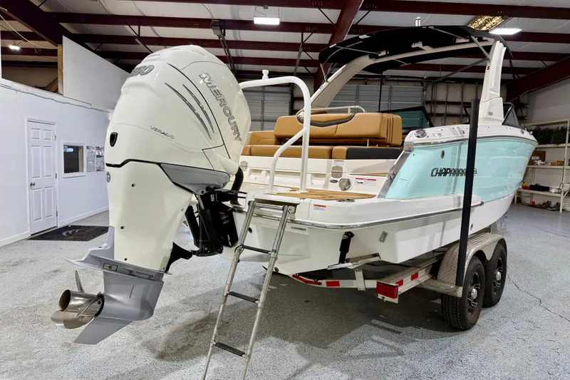 Slide: The Image of 2023 Chaparral 270 OSX boat with Mercury engine on trailer in showroom. - 7