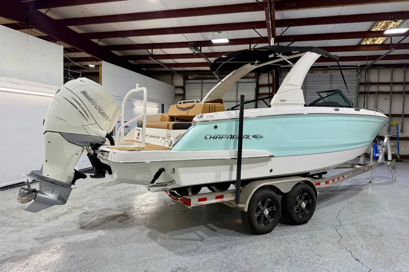 Slide: The Image of 2023 Chaparral 270 OSX boat on trailer in indoor storage facility. - 8