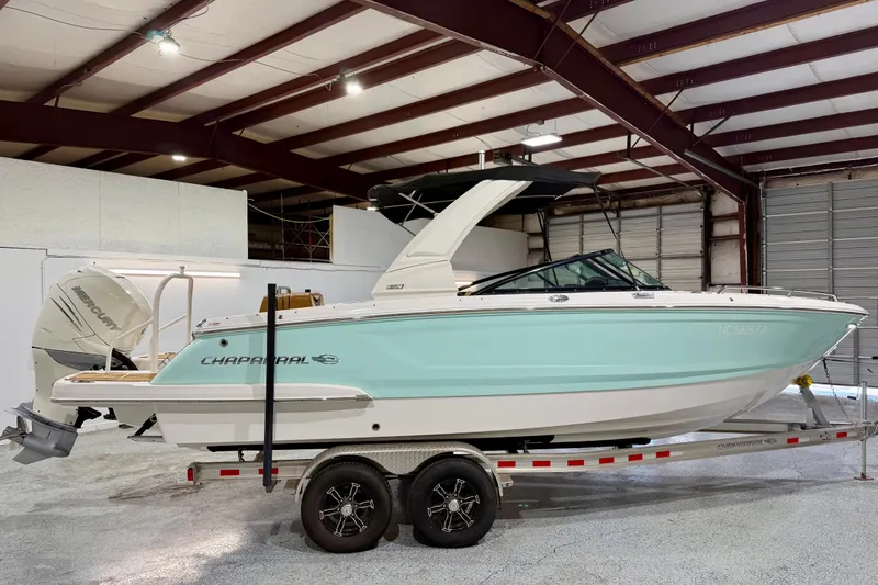Slide: The Image of 2023 Chaparral 270 OSX boat on trailer in indoor storage facility. - 9