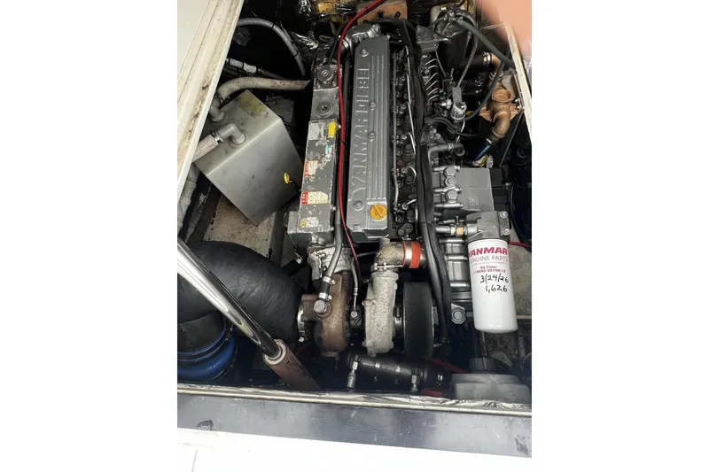 Slide: The Image of Engine compartment of a 1993 Blackfin 31 Combi boat, featuring a Yanmar engine. - 12