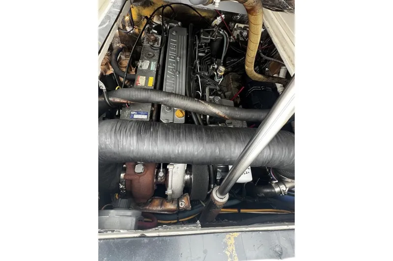 Slide: The Image of Engine compartment of a 1993 Blackfin 31 Combi boat, showcasing mechanical components. - 13