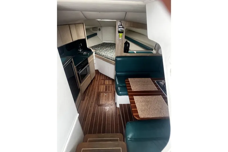 Slide: The Image of Interior of 1993 Blackfin 31 Combi boat with kitchen and seating area. - 6