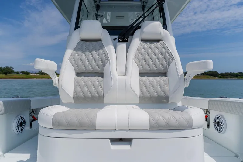 Slide: The Image of Luxury seating on a 2023 Freeman 28 boat, featuring diamond-stitched upholstery. - 23