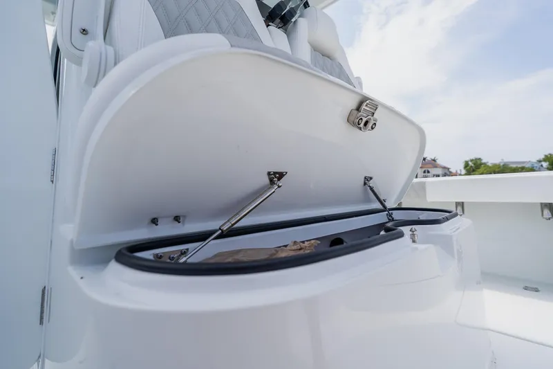 Slide: The Image of Open storage compartment on 2023 Freeman 28 boat, showcasing sleek design and functionality. - 24