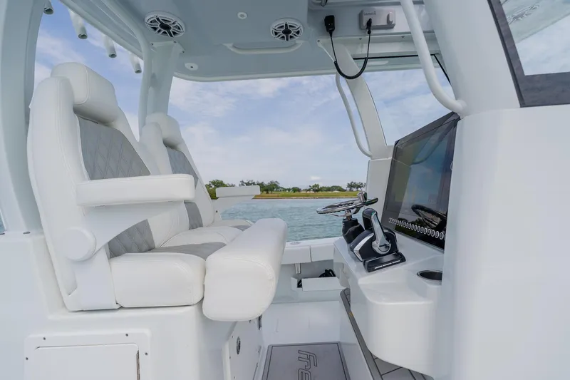 Slide: The Image of Interior of 2023 Freeman 28 boat with modern helm and seating. - 32