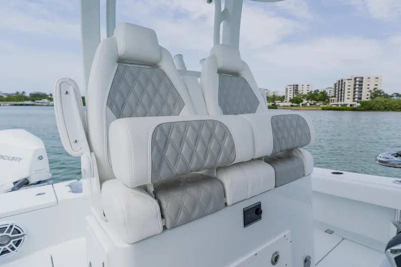 Slide: The Image of Luxurious seating on a 2023 Freeman 28 boat, featuring diamond-stitched upholstery. - 34