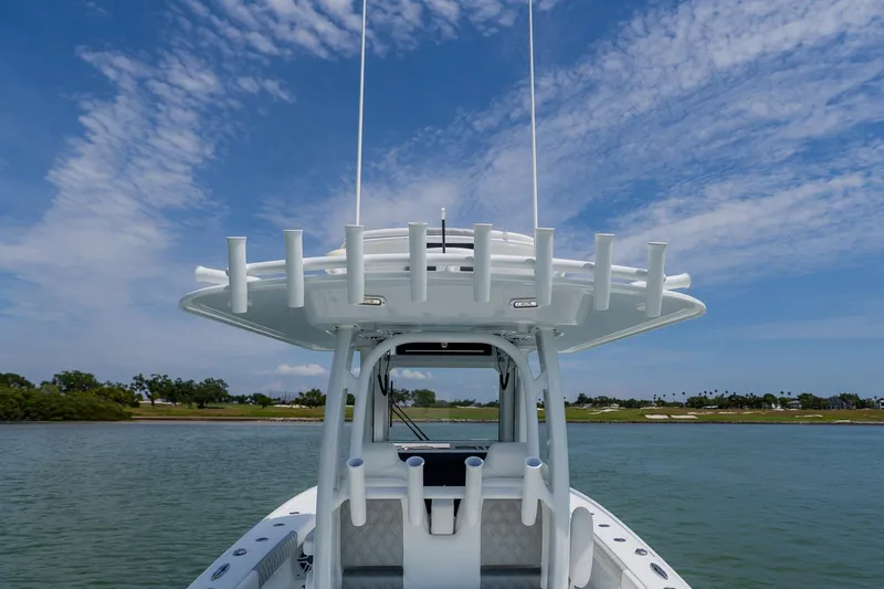Slide: The Image of 2023 Freeman 28 boat on water under clear blue sky. - 38