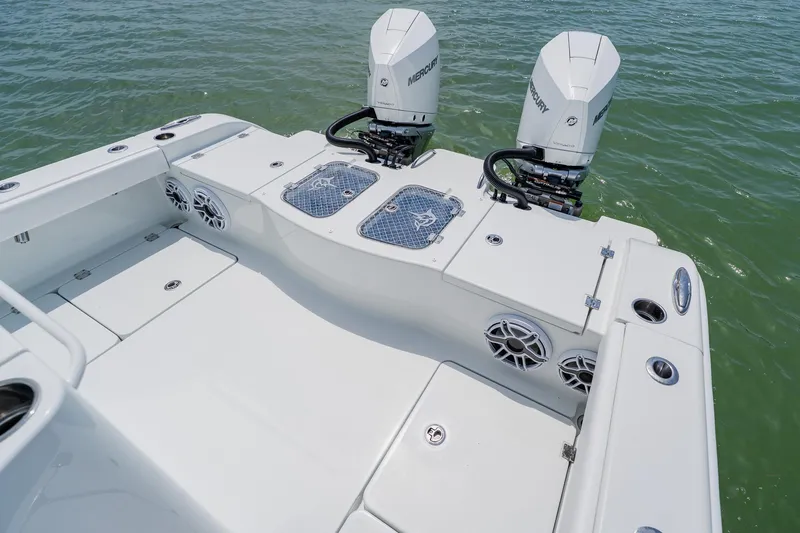 Slide: The Image of Freeman 28 boat with dual Mercury engines on calm water, 2023 model. - 40
