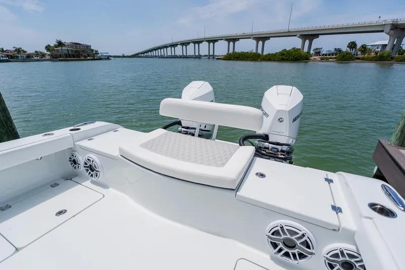 Slide: The Image of Freeman 28 boat, 2023 model, with dual Mercury engines on a scenic waterfront. - 41