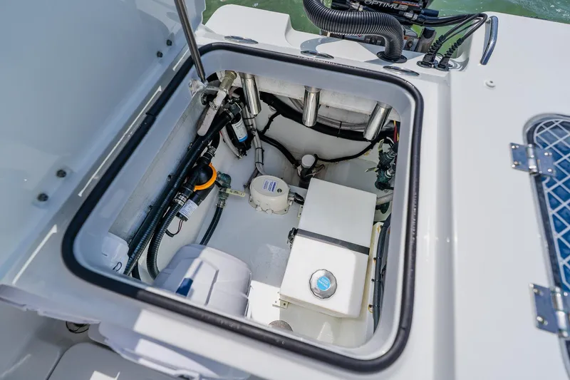 Slide: The Image of Open hatch of 2023 Freeman 28 boat showing internal components and wiring. - 48