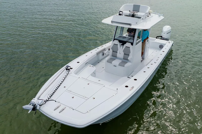 Slide: The Image of 2023 Freeman 28 boat on water, featuring sleek design and modern amenities. - 5