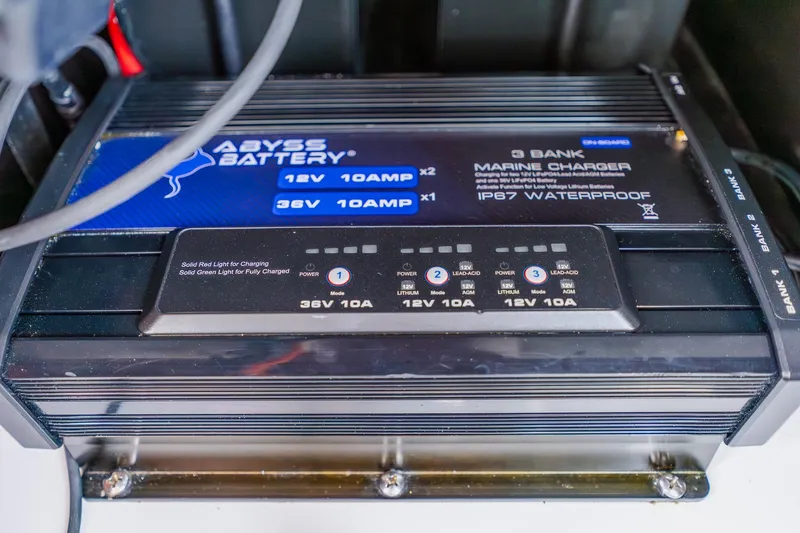 Slide: The Image of Marine battery charger in a 2023 Freeman 28, featuring IP67 waterproof design. - 55