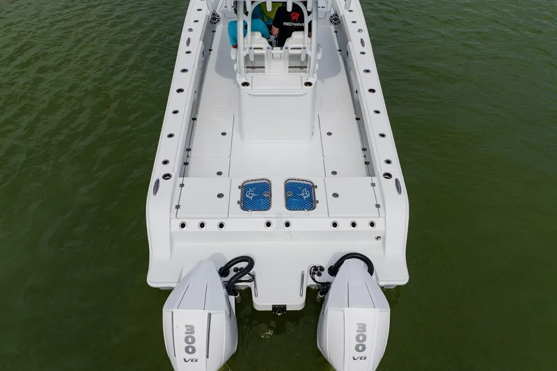 Slide: The Image of Aerial view of 2023 Freeman 28 boat with dual 300 V8 engines on water. - 6