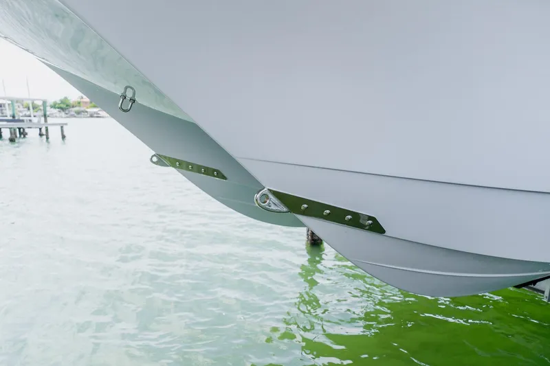 Slide: The Image of Freeman 28 boat hull detail, 2023 model, docked on calm water. - 7