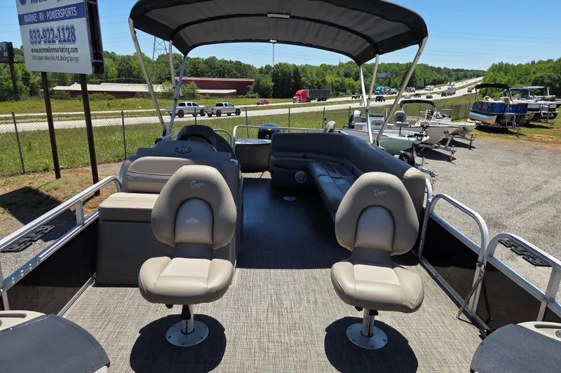 Slide: The Image of 2023 Ranger Reata 200F pontoon boat interior with seating and canopy. - 17