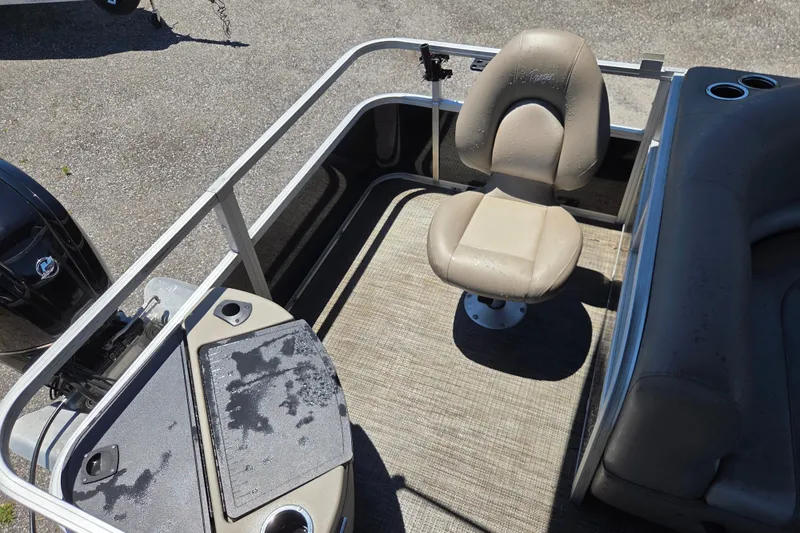 Slide: The Image of 2023 Ranger Reata 200F boat interior with beige seating and fishing deck. - 8