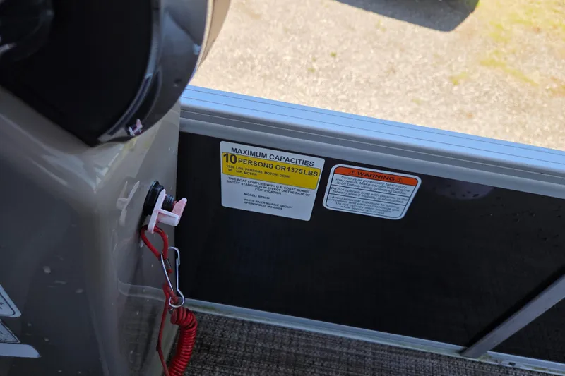 Slide: The Image of 2023 Ranger Reata 200F boat capacity label, indicating a maximum of 10 persons or 1375 lbs. - 9