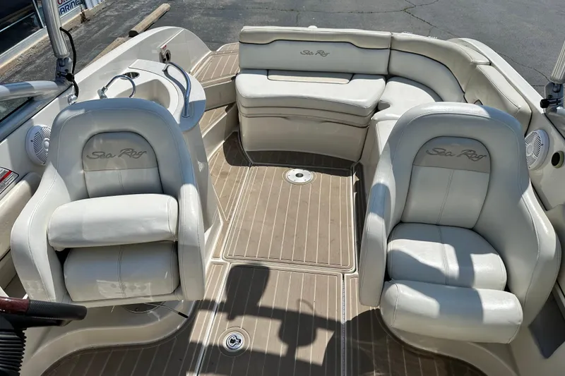 Slide: The Image of 2008 Sea Ray 260 Sundeck interior with plush seating and elegant design. - 10