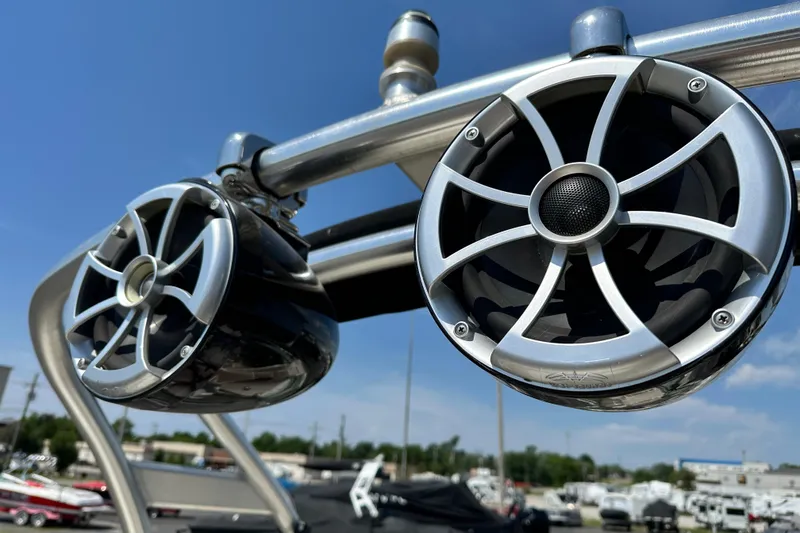 Slide: The Image of Close-up of speakers on a 2008 Sea Ray 260 Sundeck boat under a clear blue sky. - 13