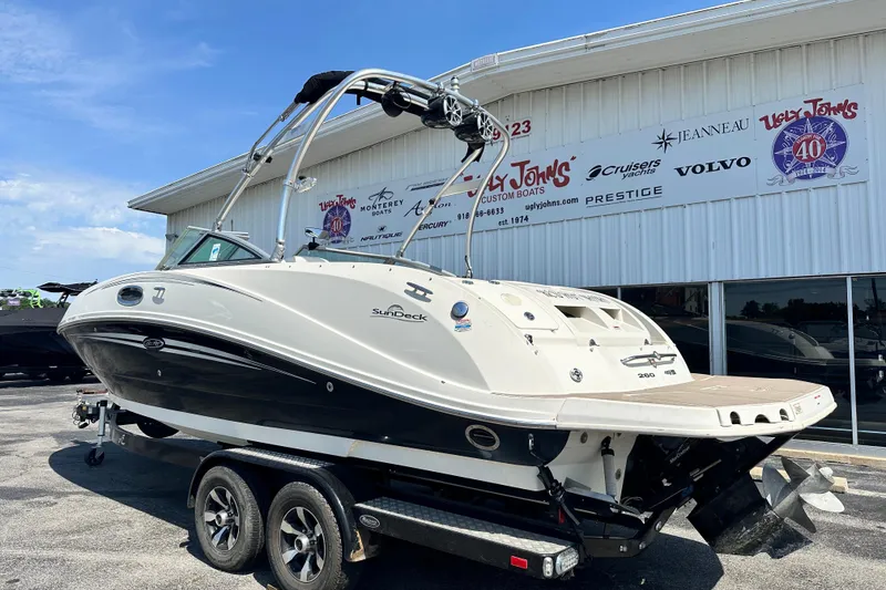 Slide: The Image of 2008 Sea Ray 260 Sundeck boat on trailer outside dealership. - 3