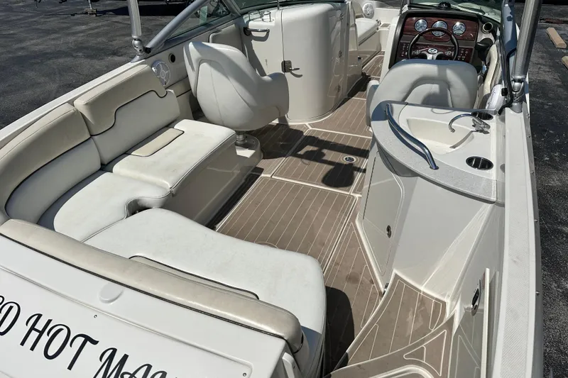 Slide: The Image of 2008 Sea Ray 260 Sundeck interior with seating, steering wheel, and deck view. - 4